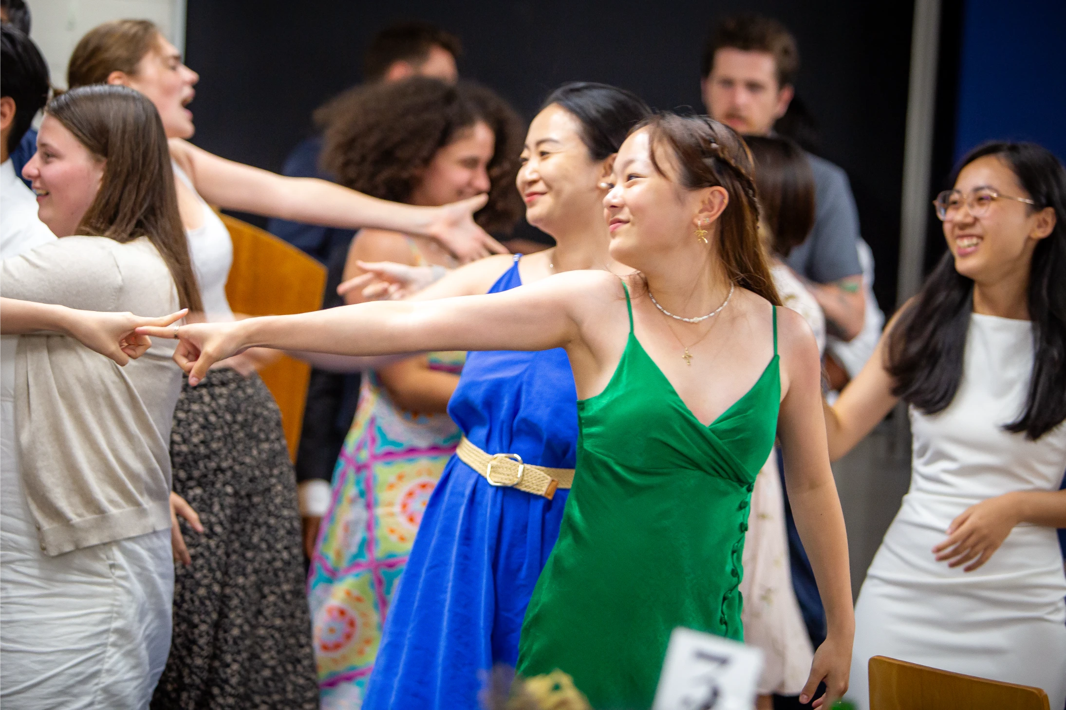 Students dancing and celebrating together at a Robert Menzies College social event.